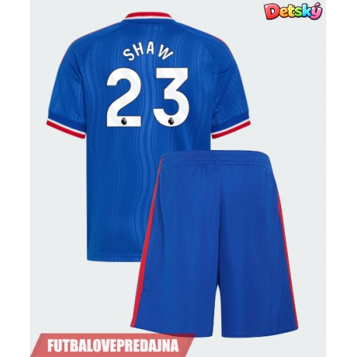 Lacne Dětský Futbalové dres Manchester United Luke Shaw #23 2026-27 Krátky Rukáv - Preč (+ trenírky)